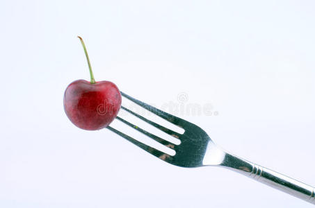 叉子上的樱桃。
