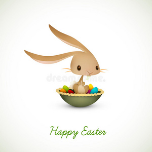 复活节兔子坐在装满彩蛋的碗里