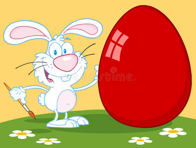 户外画红复活节彩蛋的快乐兔