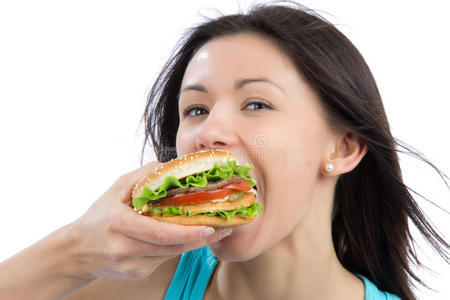 女人吃着美味的快餐不健康的汉堡