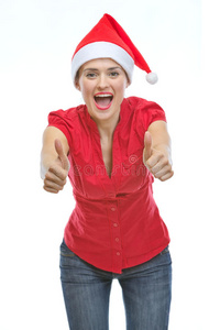 戴着圣诞帽的微笑女子竖起大拇指