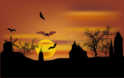 日落时蝙蝠在城堡上空飞翔
