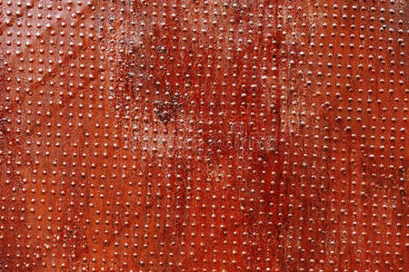 公司大门口门牌红色锈色纹理的抽象肮脏背景照片