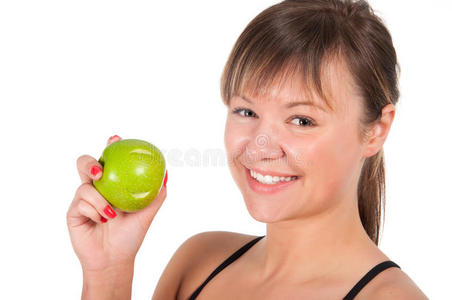 年轻漂亮的运动女郎，戴着绿苹果，被白色隔离