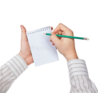 男人在笔记本上写字照片