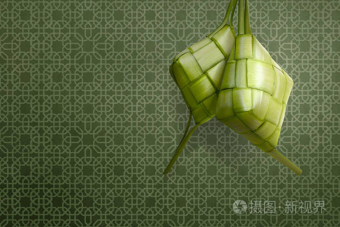 Ketupat 是传统食物为开斋节庆祝在绿色背景下照片 正版商用图片0n2jcb 摄图新视界