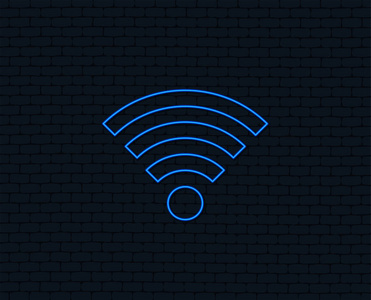 霓虹灯。Wifi 标志。无线网络符号。无线网络图标。Wifi 区域。发光的平面设计。砖墙。矢量