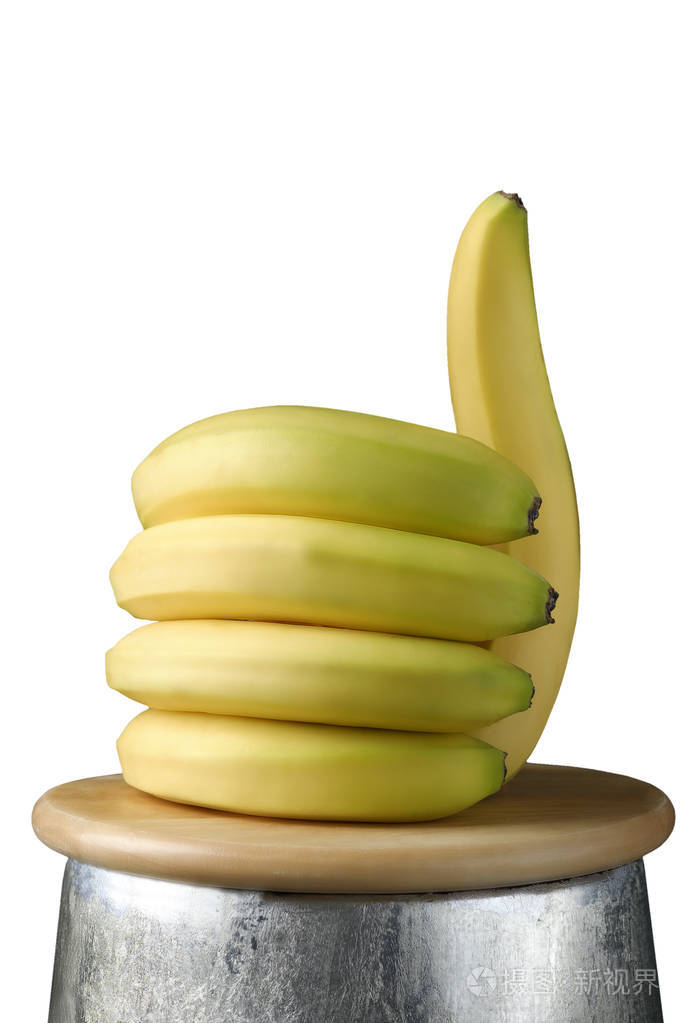 香蕉的形状与拇指的手像健康的食物概念