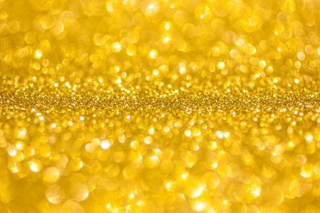 金色闪光圣诞抽象背景.闪亮的金色光芒照片