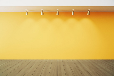 空旷的房间里与 lapms 和木地板的黄墙