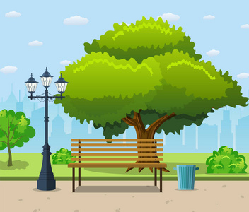 城市公园的长椅上,绿色的大树下照片