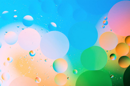 基于石油的混合水和油, 美丽的颜色抽象背景基于圆和椭圆形照片