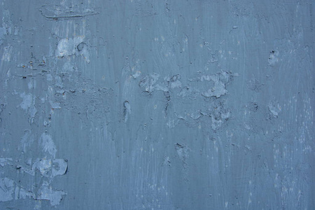 纹理的老式生锈的灰色铁墙背景与许多层的油漆和铁锈