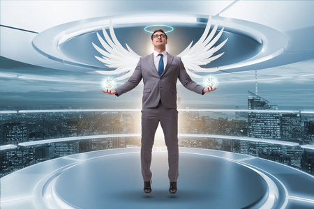 商人带翅膀的天使投资者概念照片