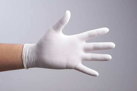 戴着乳胶手套的手照片