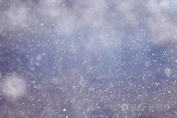 雪花飘落在模糊背景的纹理