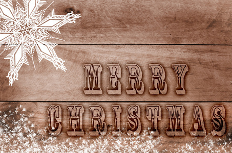 词语写，烧的信木雪棕色背景上的圣诞快乐