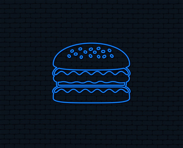 霓虹灯。汉堡包图标。汉堡食品的象征。芝士汉堡三明治标志。发光的平面设计。砖墙。向量