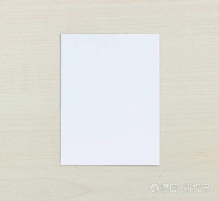 白色纸放在木桌的背景照片-正版商用图片0nwibg-摄图新视界