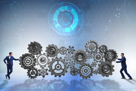 商人在经营理念推动齿轮车轮照片