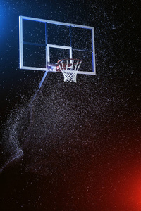 篮球筐上黑色孤立。下大雨的篮球馆。通过混合的颜色灯变亮