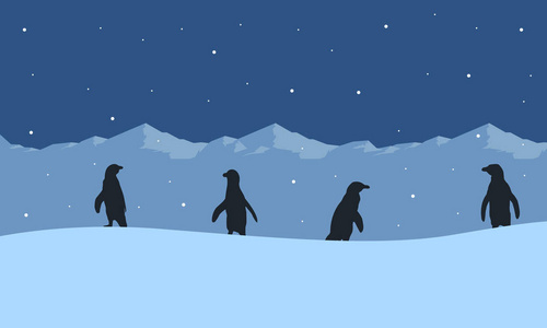 企鹅在冰的山景的剪影