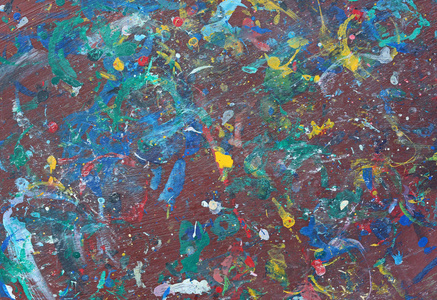 抽象的彩色纹理背景。在木桌上飞溅丙烯酸颜色