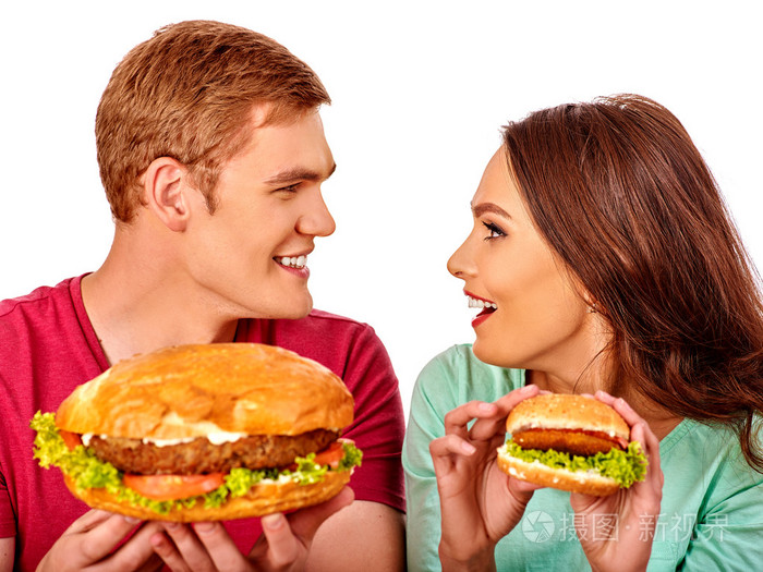 男人和女人吃汉堡包