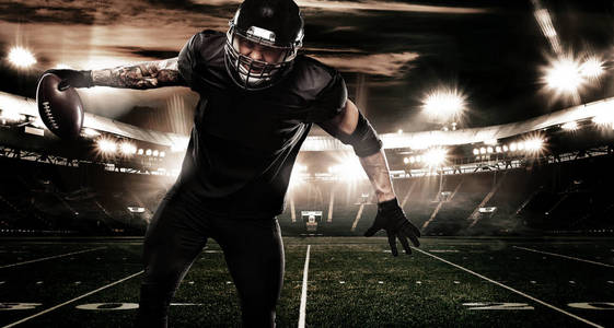 美国橄榄球运动员球员在体育场。体育横幅和壁纸与 copyspace