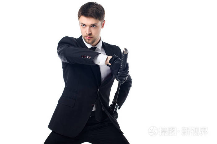 自信的代理人在西装和手套与武士刀隔离在白色