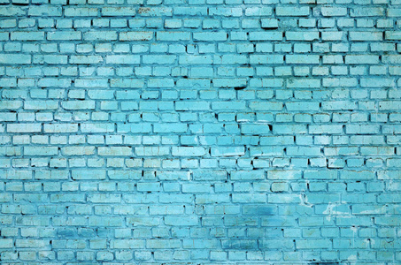 方形砌块墙体的背景和质地。涂在蓝色