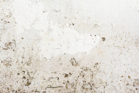 浮雕旧白墙的质地, 不均匀的浅灰色表面的石膏与裂缝和凹痕