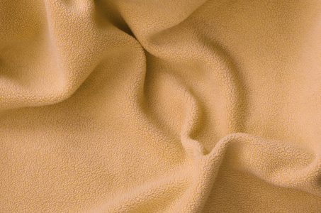 毛茸茸的橙色羊毛布的毯子.