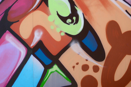 街头艺术。彩色涂鸦画片断的抽象背景图像在时髦的颜色