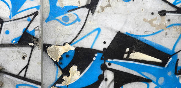 街头艺术。在铬和蓝色色调的彩色涂鸦画片断的抽象背景图像