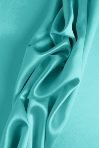 抽象背景豪华布或液体波或波浪褶皱的 grunge 丝绸质地缎天鹅绒材料或