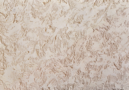 米色粗糙的墙壁纹理背景。抽象灰泥。墙上石膏的质地