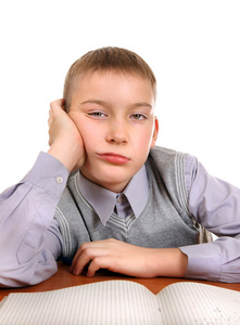 漂亮的男孩和女孩无聊的关于做家庭作业,小孩强调美好的无聊的女孩做