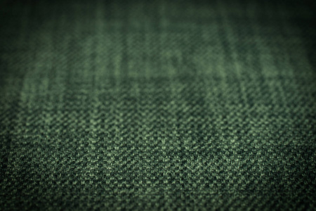 绿色织物纹理。抽象的背景下，空模板。选择性的焦点