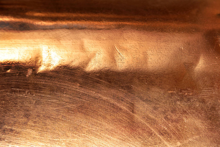 刮痕纹理镀铜背景特写照片