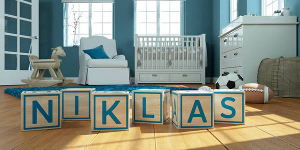 在儿童房里用木制玩具立方体写的名字niklas