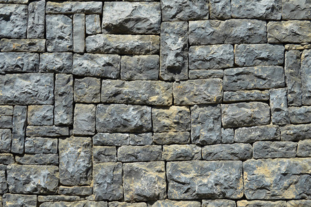 蓝花岗岩蓝石头砌的墙照片
