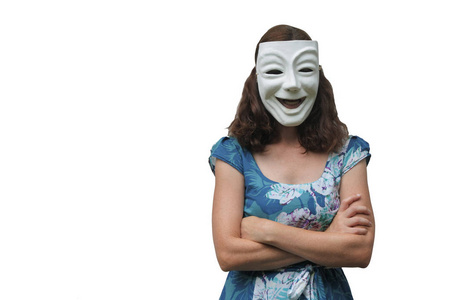 自信的女人戴着带双臂的笑脸面具