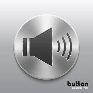 增加声音具有金属拉丝质感和孤立在灰色的背景上的的圆扬声器按钮