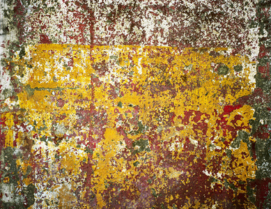 生锈的铁墙上覆盖着油漆，抽象纹理背景