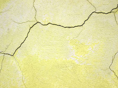 黄色的墙体损坏的纹理，为设计为背景