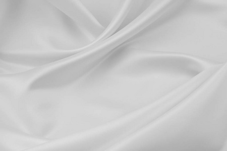 波纹状的白色丝织物的特写图片