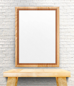 空白的木制相框挂在白色的砖墙木选项卡上的