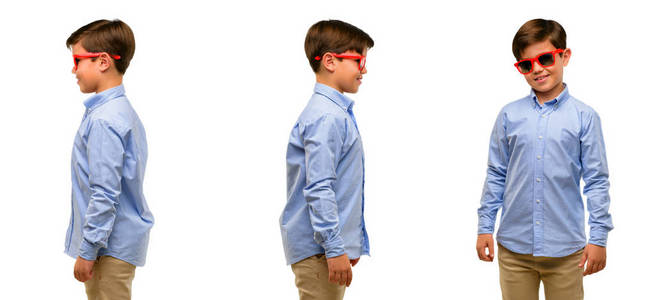 英俊的学步儿童与绿色眼睛侧面视图肖像照片