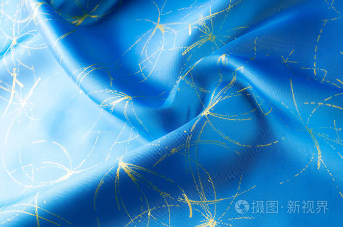 布料蓝色丝绸与金子样式.